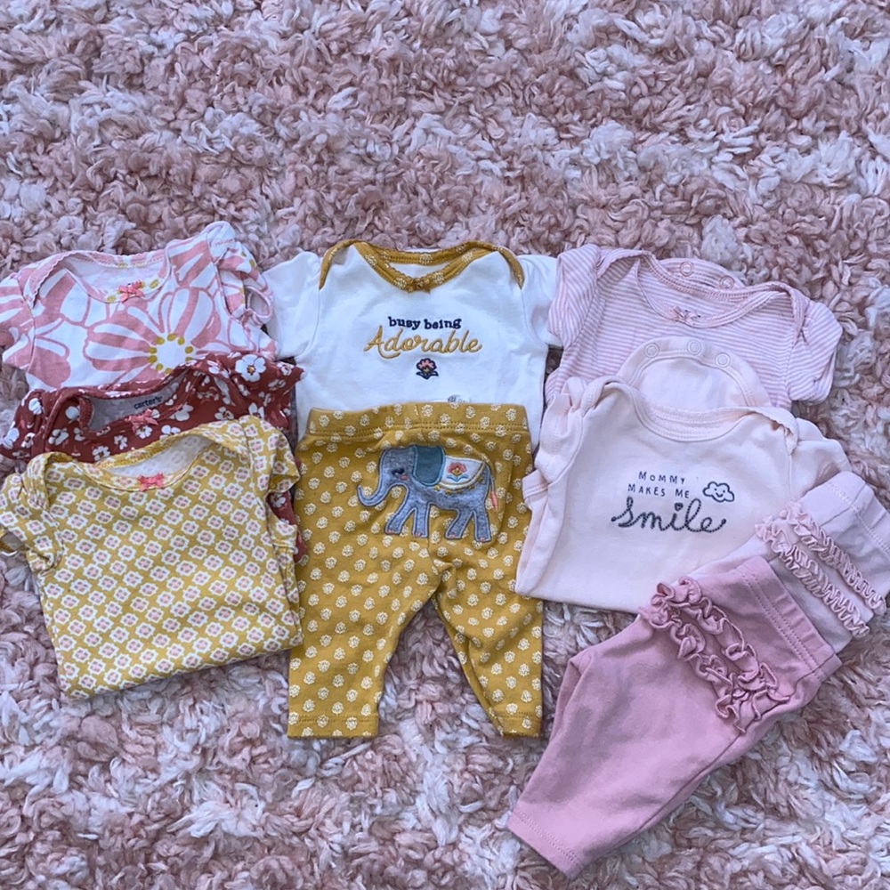 Bundle of newborn baby girl clothes